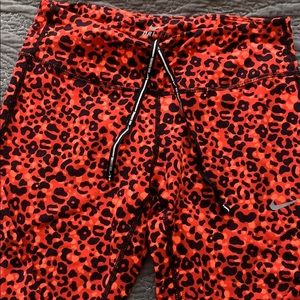 Like New running pants. Orange leopard print.